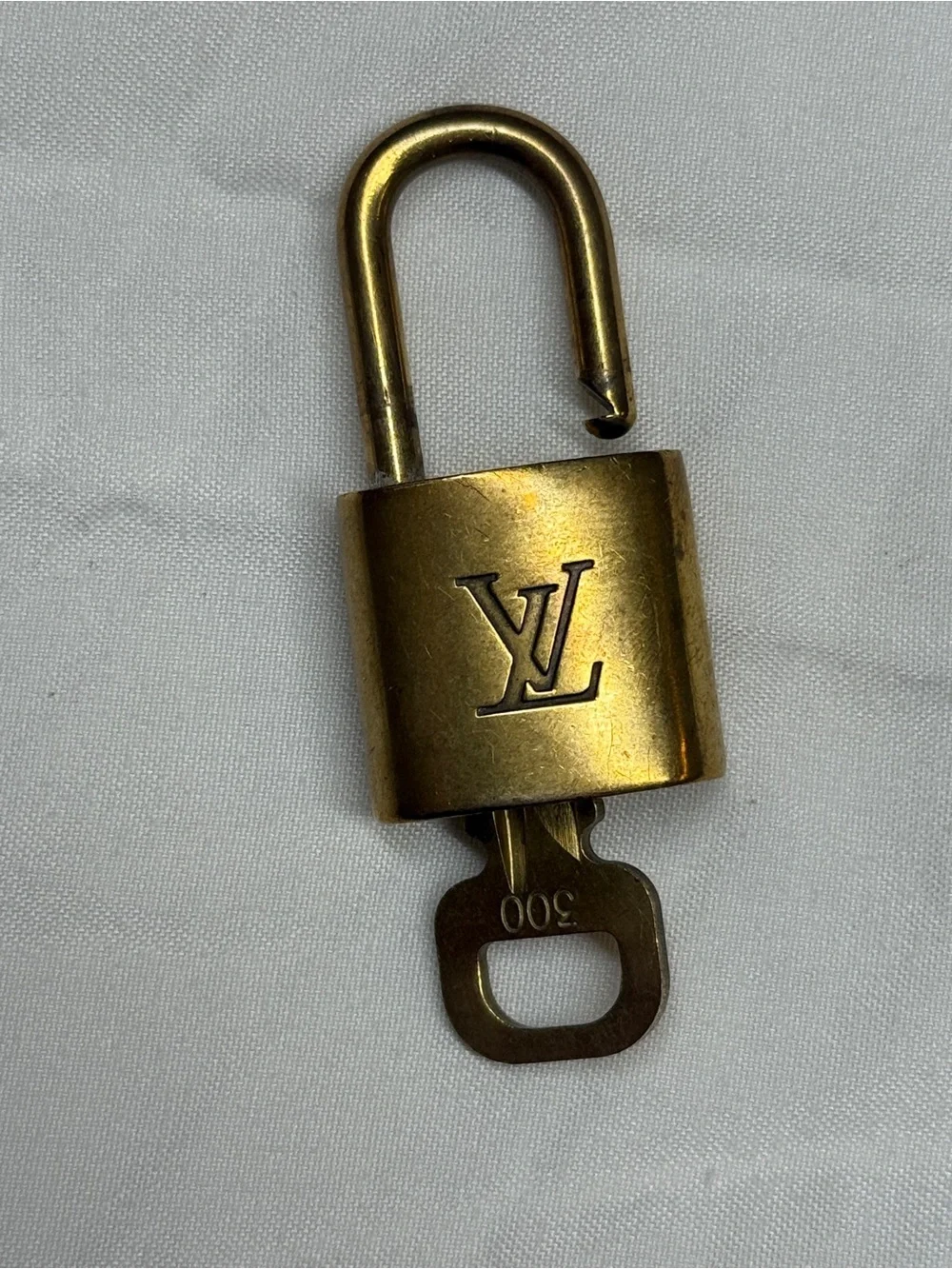 Louis Vuitton Gold Tone Monogram Padlock with Key # 300